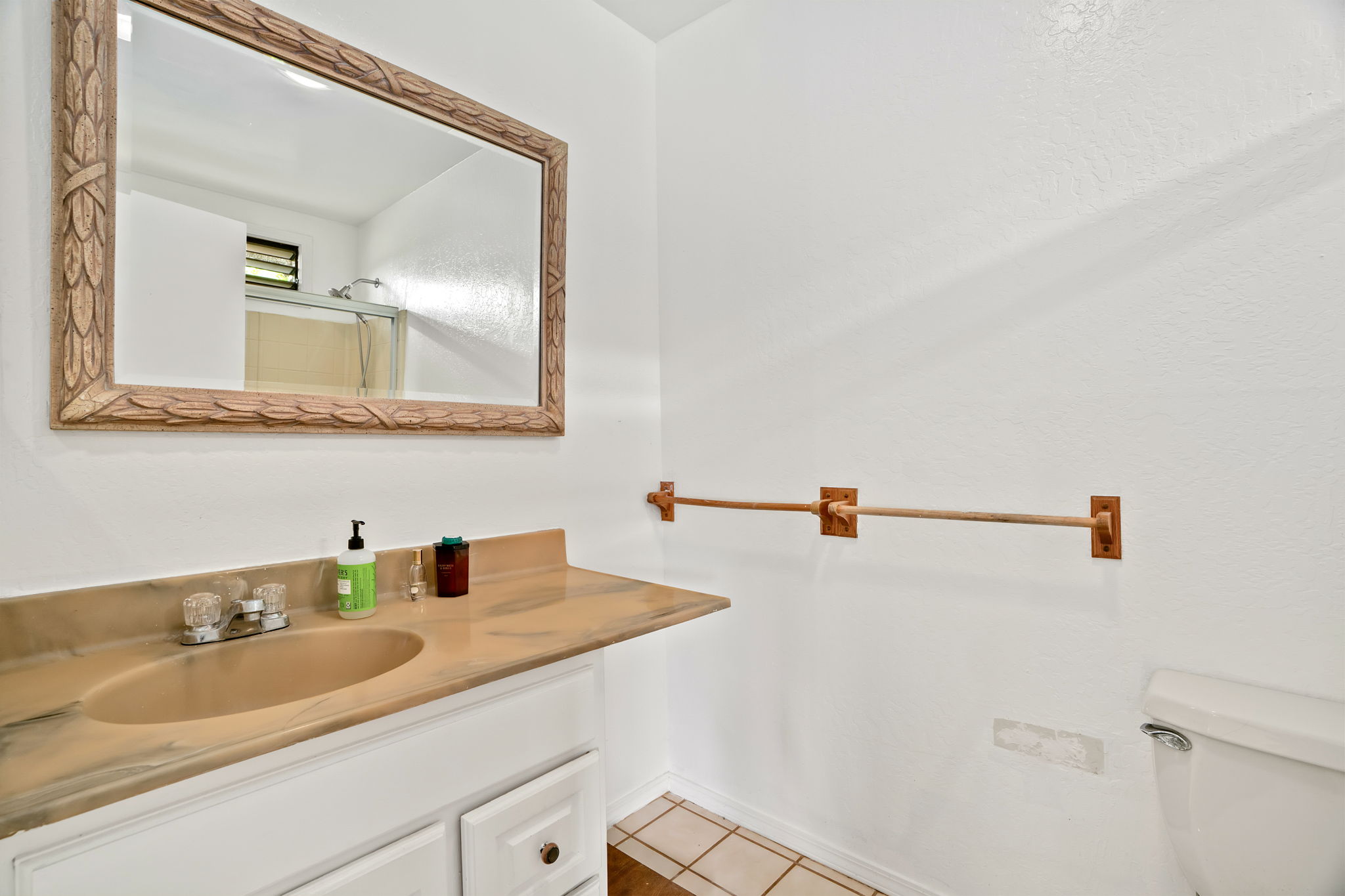 5366 Kumole Street Kapaa, HI 96746 - Photo 20 of 30 a bathroom with a sink and a mirror