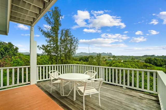 a view of a chair and table on the wooden floor