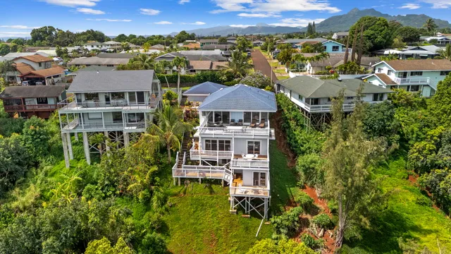 an aerial view of a house with a garden