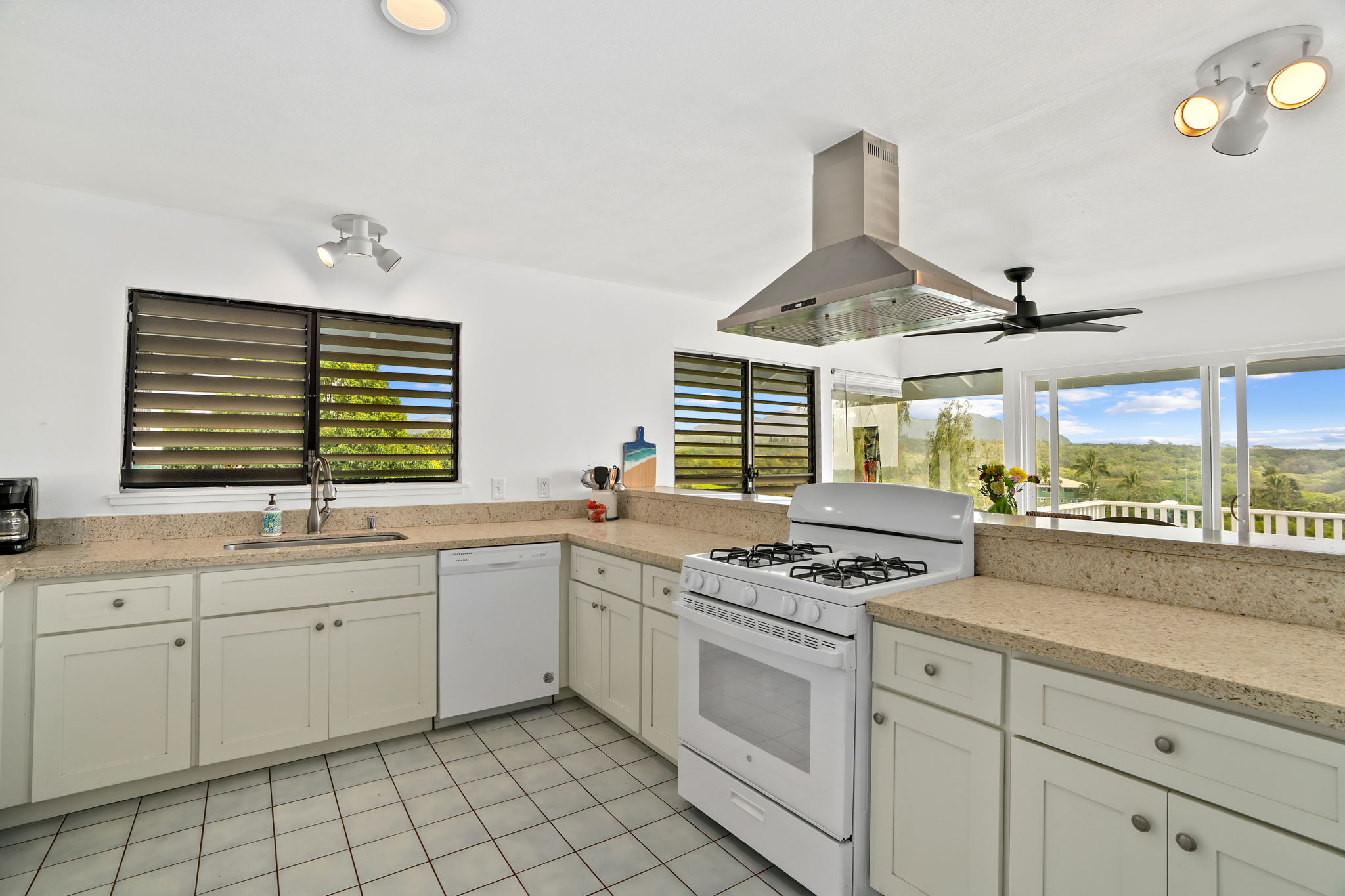 5366 Kumole Street Kapaa, HI 96746 - Photo 5 of 30 a kitchen that has a sink and a stove