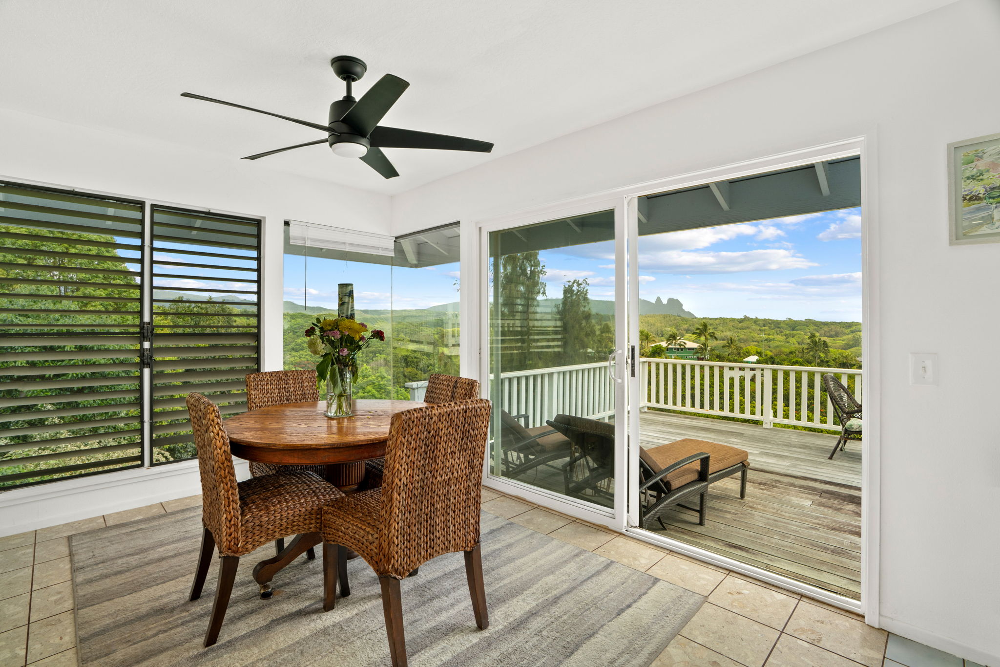 5366 Kumole Street Kapaa, HI 96746 - Photo 7 of 30 a dining room with furniture a potted plant and a rug