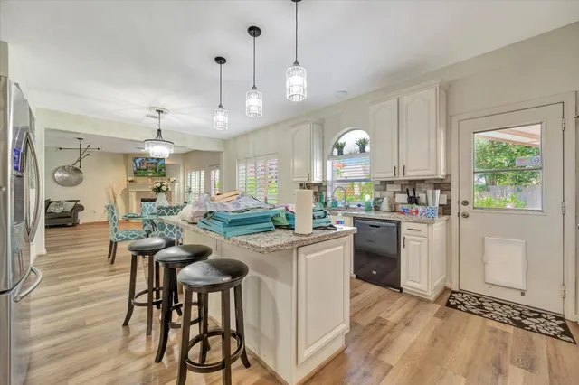 a bathroom with a double vanity sink and mirror