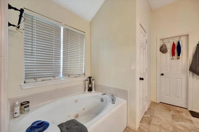 a bathroom with a bathtub and a shower