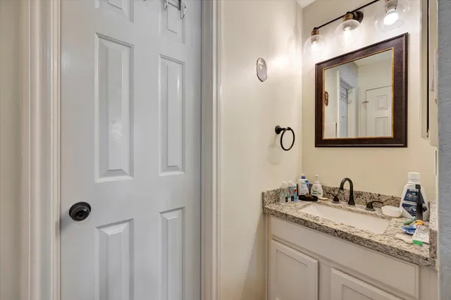 a bathroom with a double vanity sink and mirror