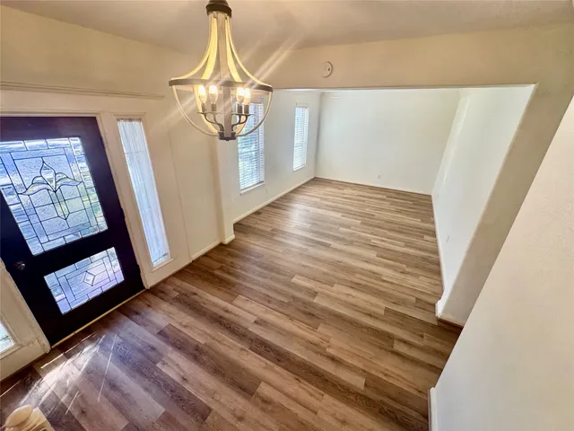 a view of entryway with wooden floor