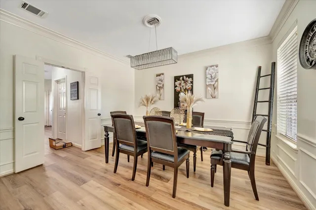 a kitchen with kitchen island a large counter top space a sink stainless steel appliances and cabinets