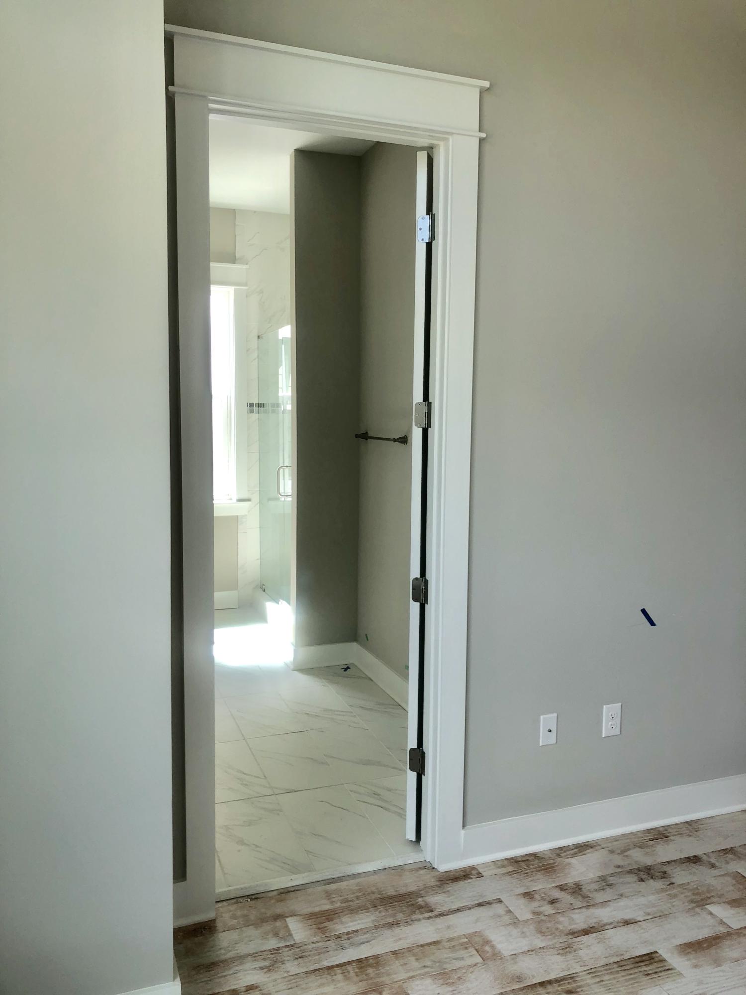84 Dune Comet Ln Inlet Beach, Unit B Inlet Beach, FL 32461 - Photo 17 of 27 a view of a hallway with wooden floor and a bathroom