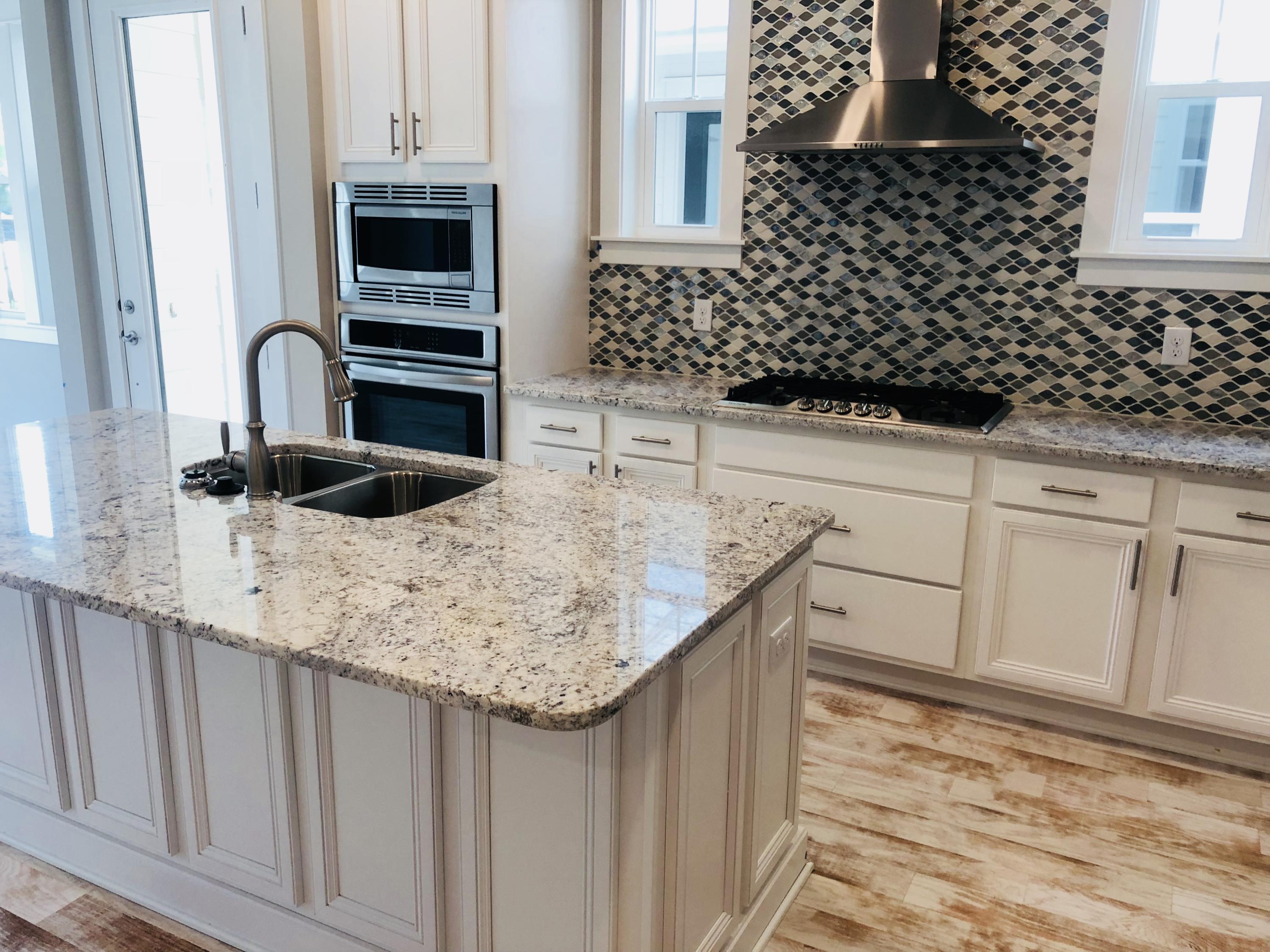84 Dune Comet Ln Inlet Beach, Unit B Inlet Beach, FL 32461 - Photo 5 of 27 a kitchen with granite countertop a sink and a stove