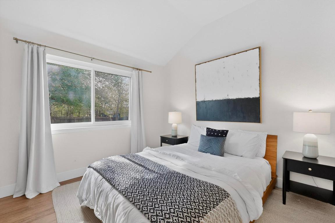 2511 Ashley Way Austin, TX 78744 - Photo 11 of 23 Primary bedroom with wood floors