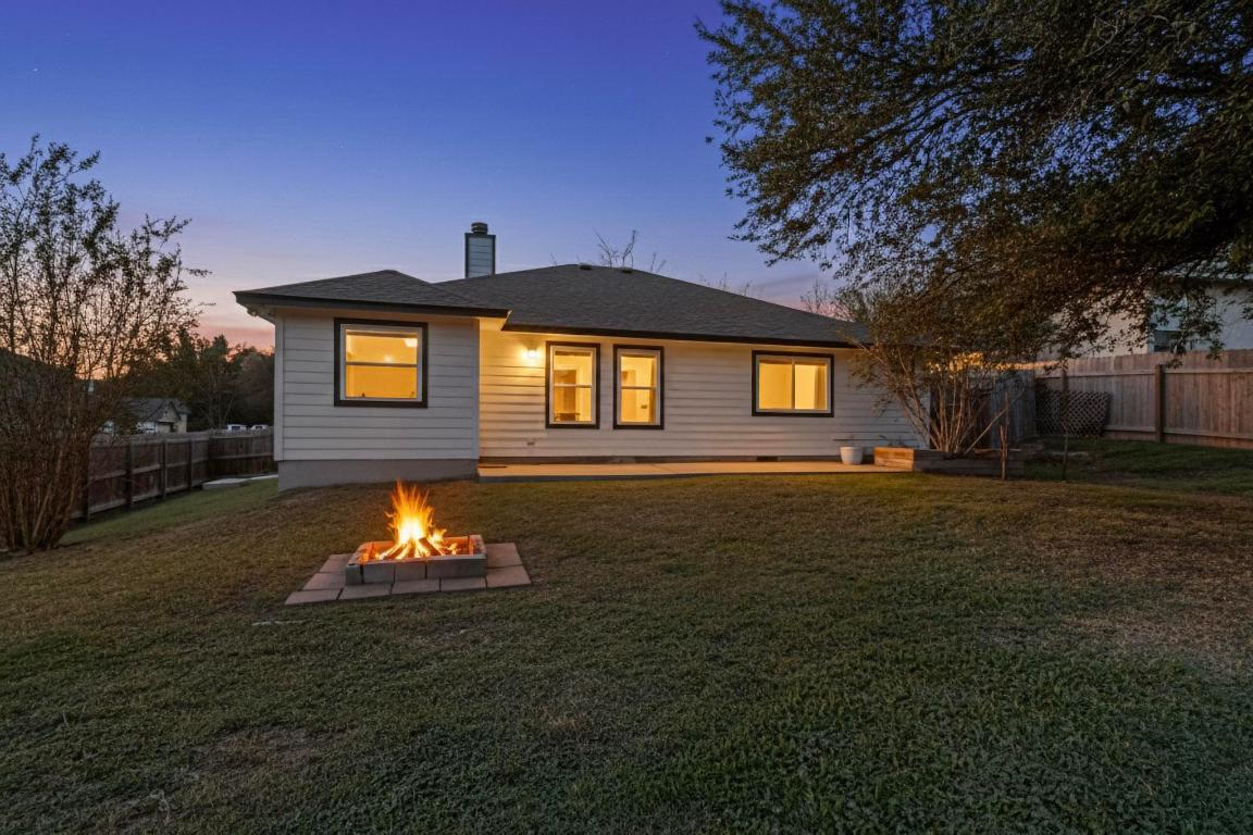 2511 Ashley Way Austin, TX 78744 - Photo 21 of 23 Rear view of property with a fenced backyard, a patio area
