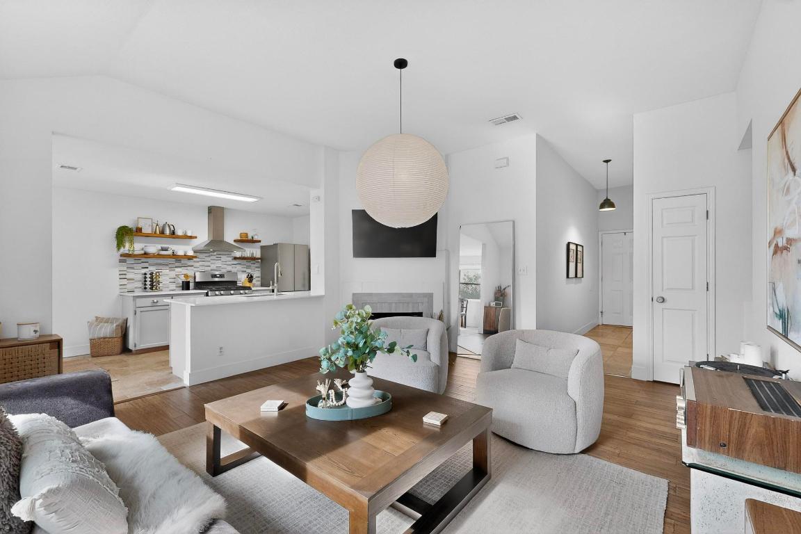 2511 Ashley Way Austin, TX 78744 - Photo 6 of 23 Living room with a fireplace