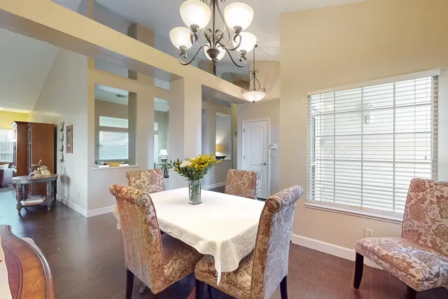 a view of a livingroom with furniture window and wooden floor