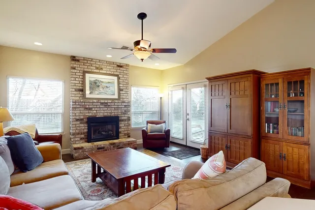 a kitchen with kitchen island granite countertop cabinets and refrigerator