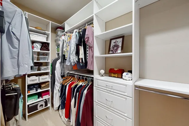a spacious bathroom with a granite countertop sink a mirror and a