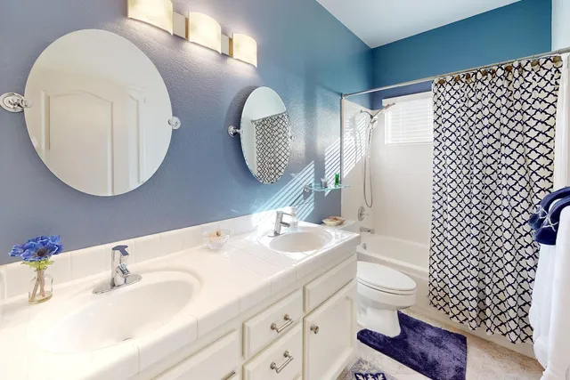 a bathroom with a sink and mirror