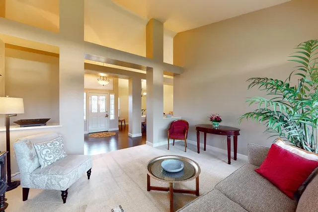 a living room with furniture and a table