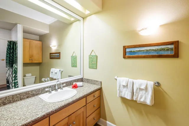 a view of balcony with floor to ceiling windows and wooden fence