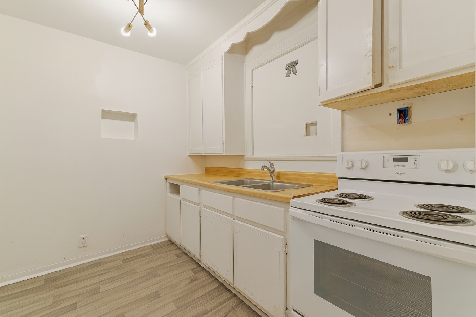 309 Harris Street Madison, TN 37115 - Photo 6 of 52 a view of cabinets with wooden floor