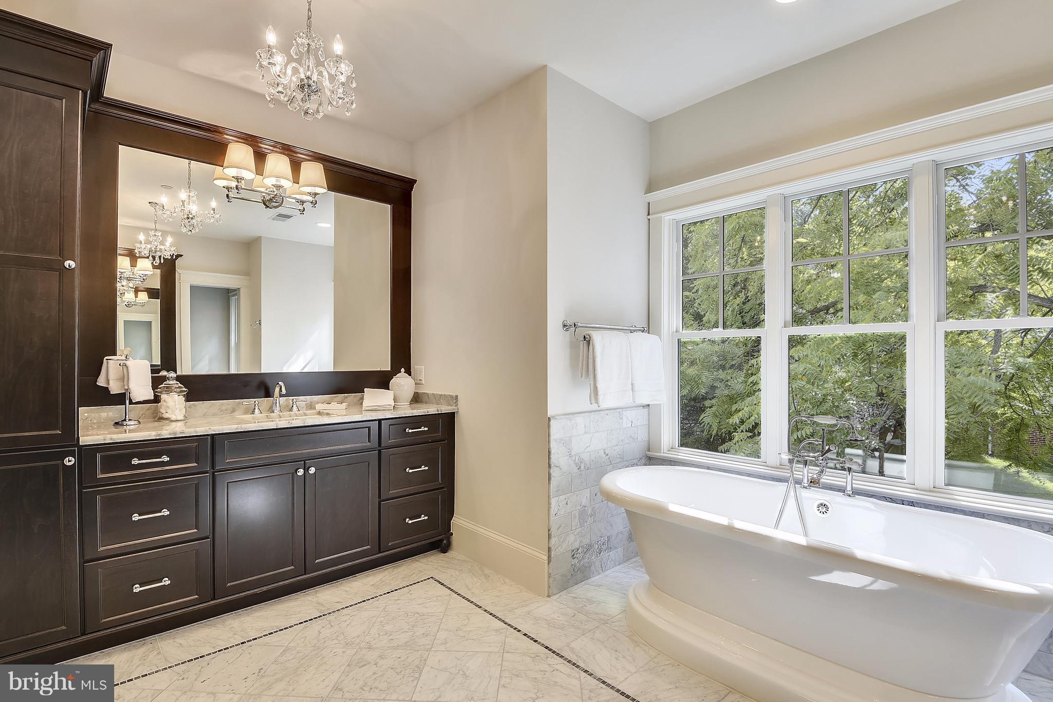 7810 Custer Road Bethesda, MD 20814 - Photo 11 of 30 a spacious bathroom with a large tub sink and double vanity