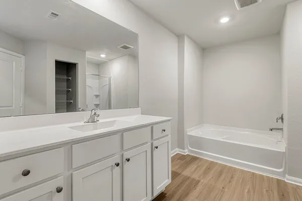 a white bath tub and shower