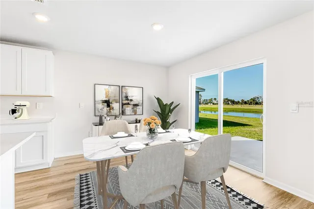 a dining room with furniture and window