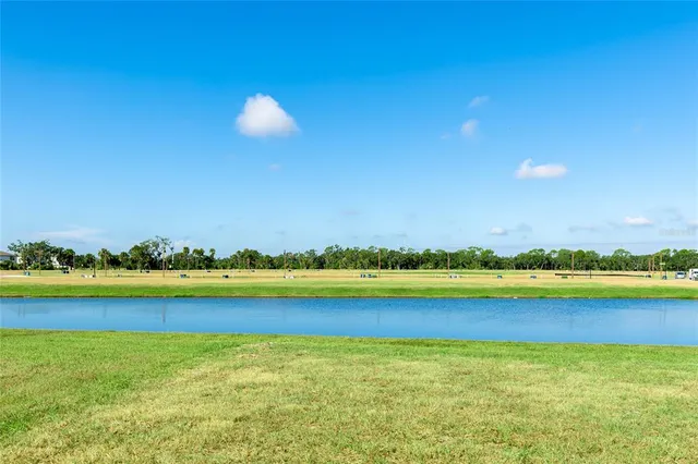 a view of an empty room with swimming pool