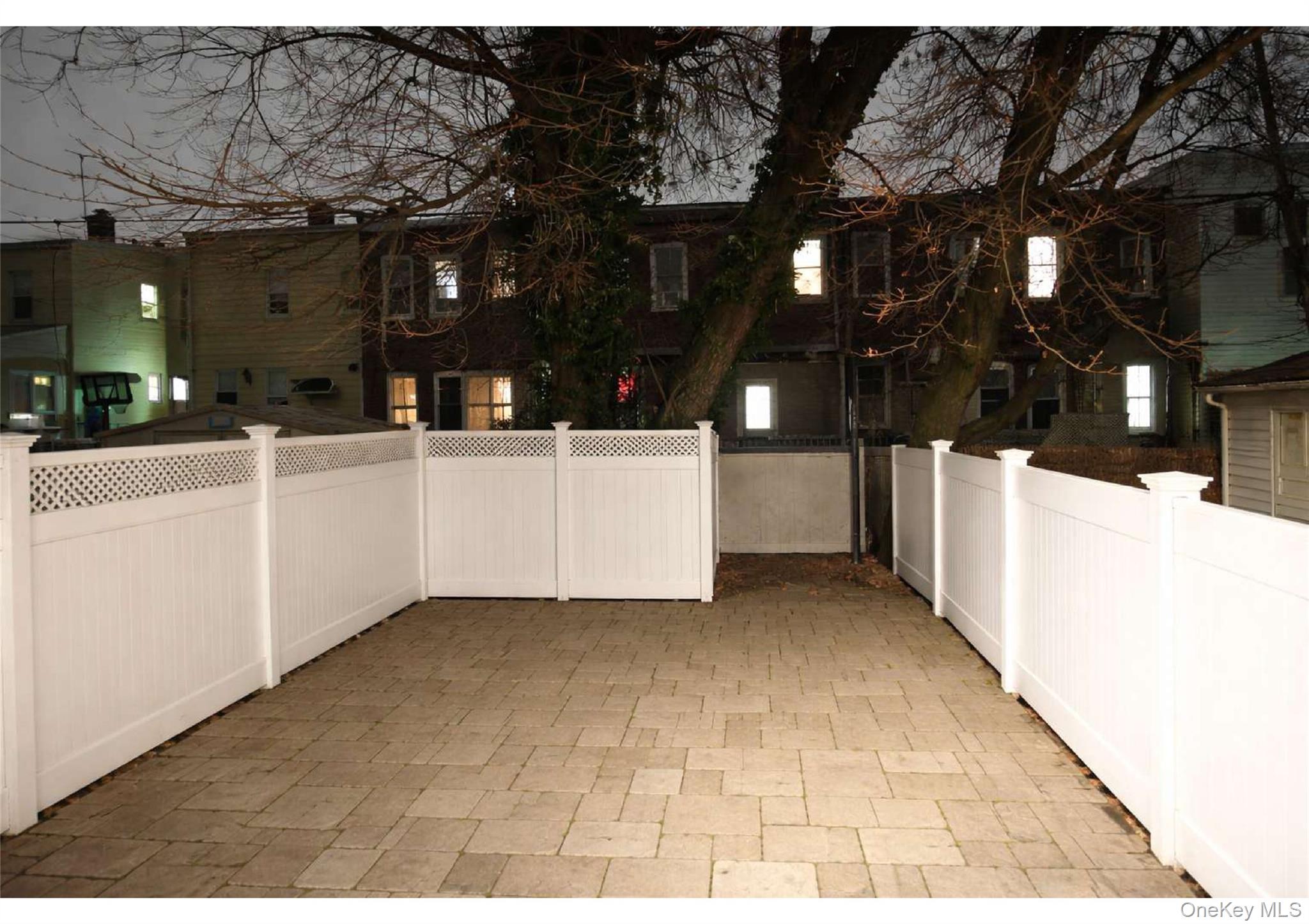 86-19 79th Street Queens, NY 11421 - Photo 15 of 19 a view of a house with a snow