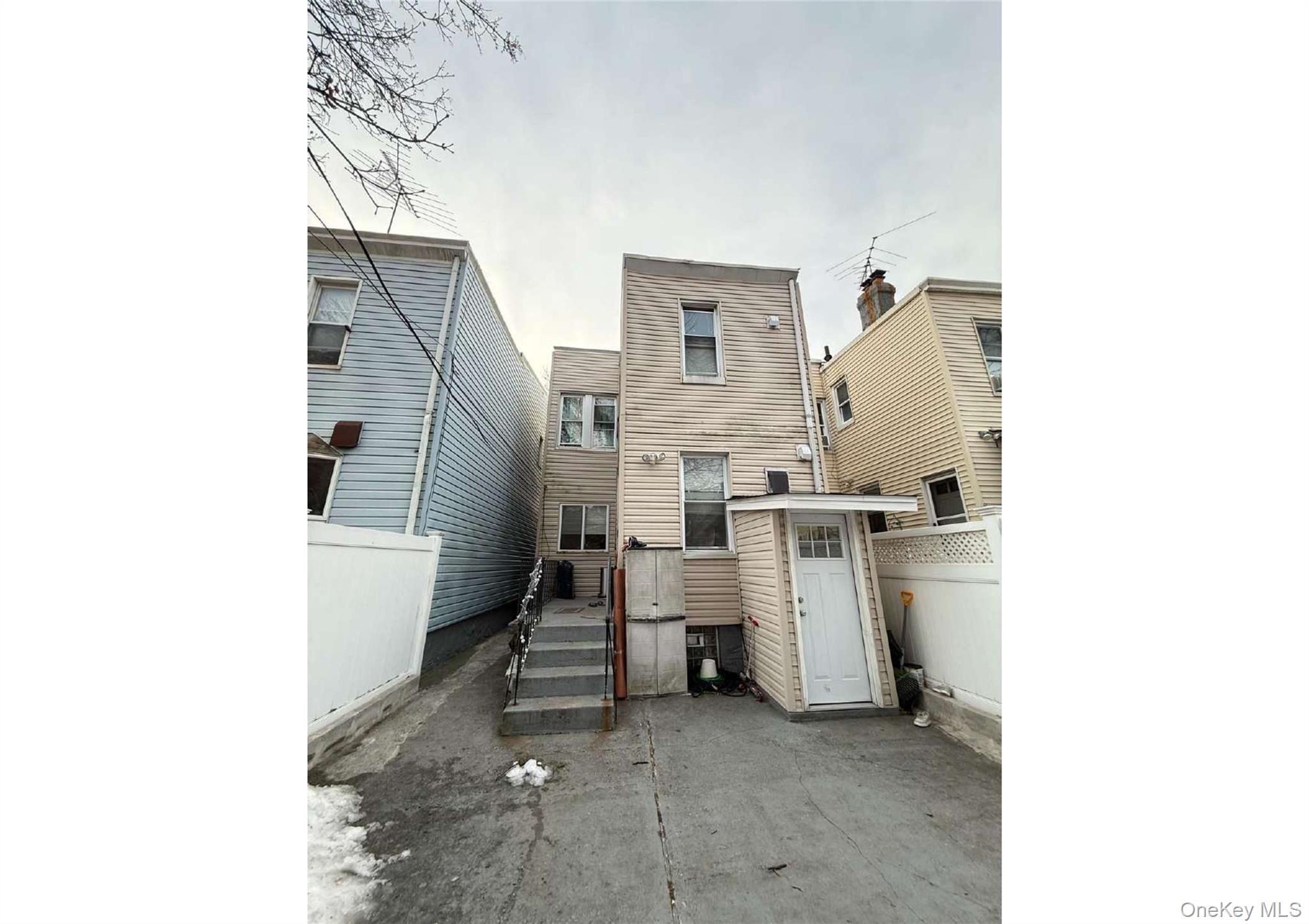 86-19 79th Street Queens, NY 11421 - Photo 2 of 19 a utility room with dryer and washer