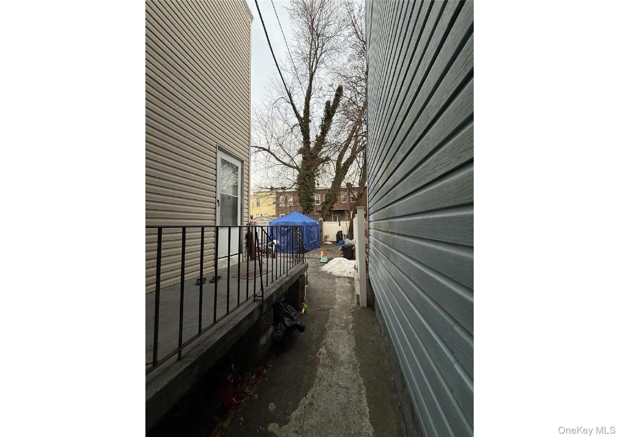 86-19 79th Street Queens, NY 11421 - Photo 3 of 19 a view of a house with a trees