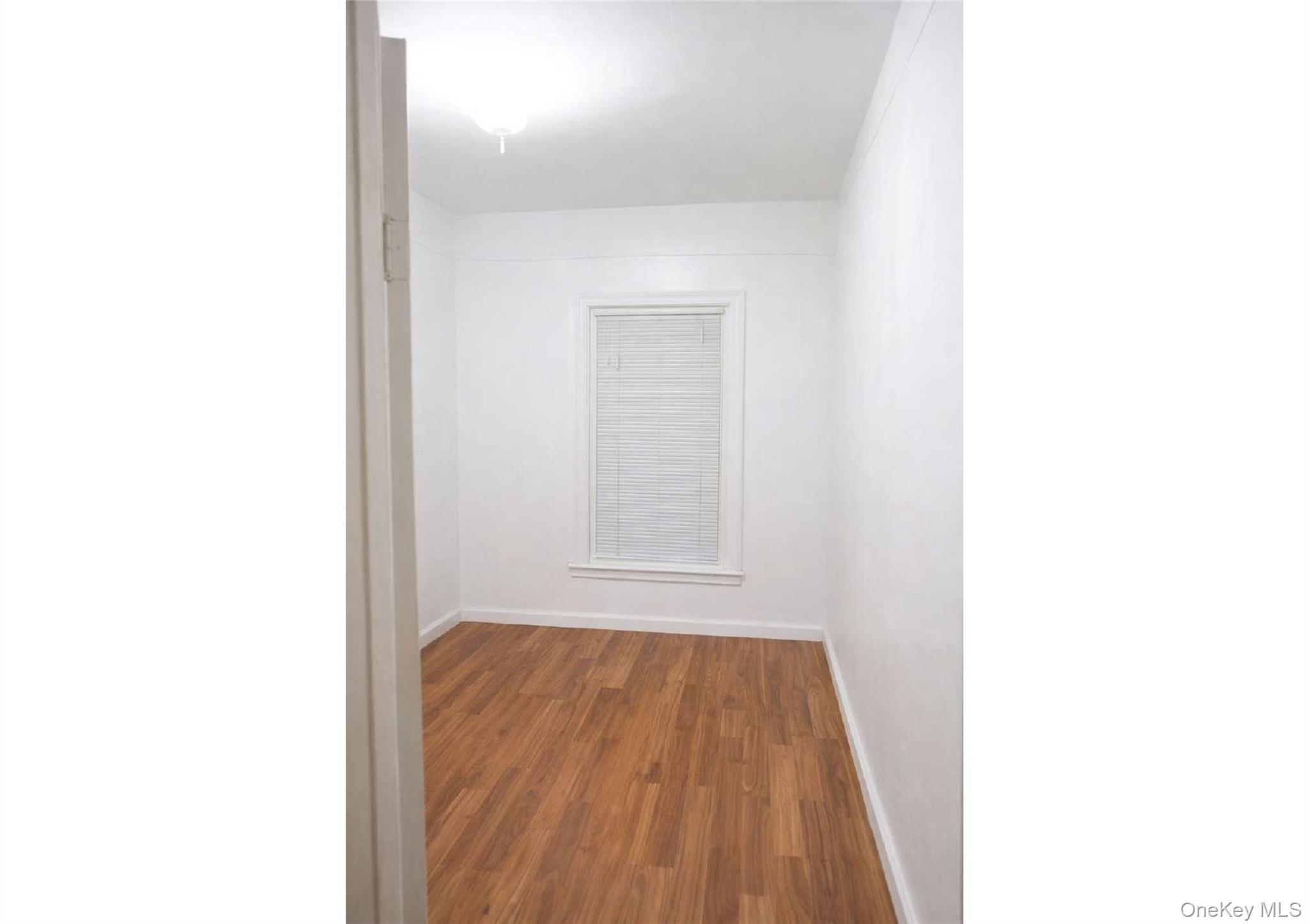 86-19 79th Street Queens, NY 11421 - Photo 5 of 19 a view of a room with a window