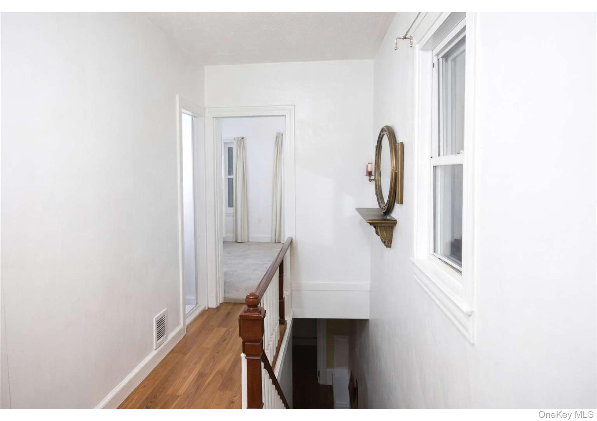 86-19 79th Street Queens, NY 11421 - Photo 9 of 19 a view of hallway with stairs