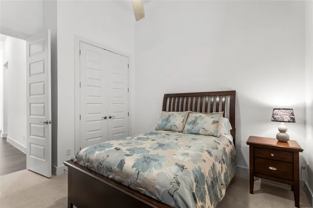 a bedroom with a bed and a cabinets