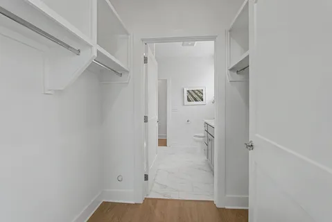 a bathroom with a sink a mirror and a toilet