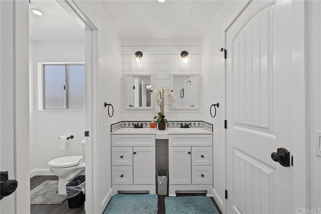 394 Tolbert Street Brea, CA 92823 - Photo 15 of 21 a spacious bathroom with a double vanity sink a toilet and a mirror