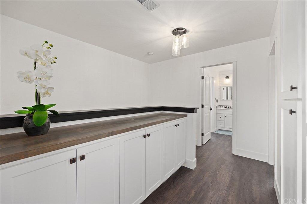 394 Tolbert Street Brea, CA 92823 - Photo 18 of 21 a kitchen with white cabinets and center island