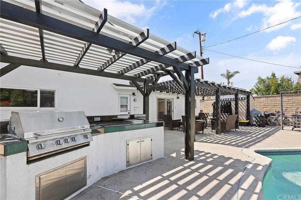 394 Tolbert Street Brea, CA 92823 - Photo 20 of 21 a kitchen with a stove a sink and cabinets