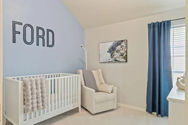 a bedroom with a bed and couch