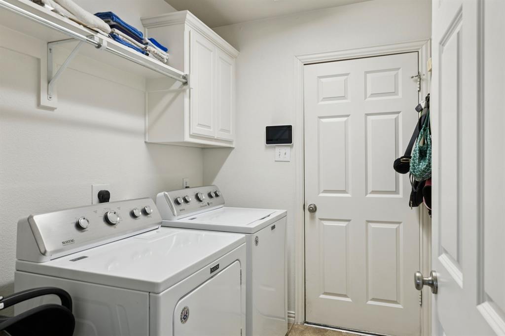 910 Fox Ridge Trail Prosper, TX 75078 - Photo 18 of 25 a utility room with dryer and washer