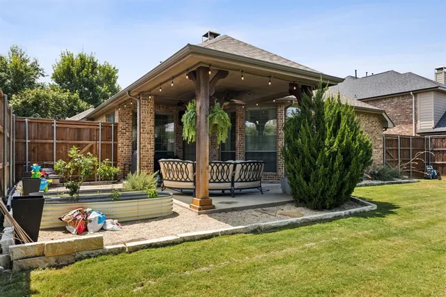 a view of a chair and tables in the patio