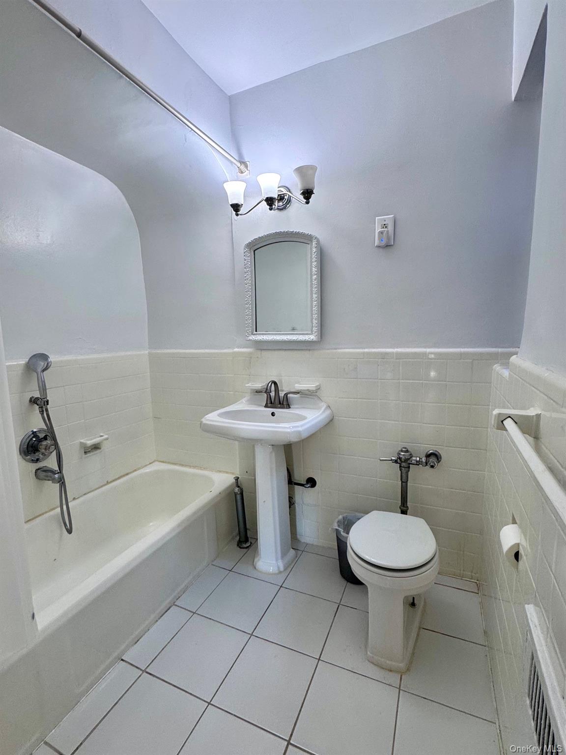 110-35 72nd Road, Unit 503 Queens, NY 11375 - Photo 13 of 15 a bathroom with a sink a toilet and a bathtub