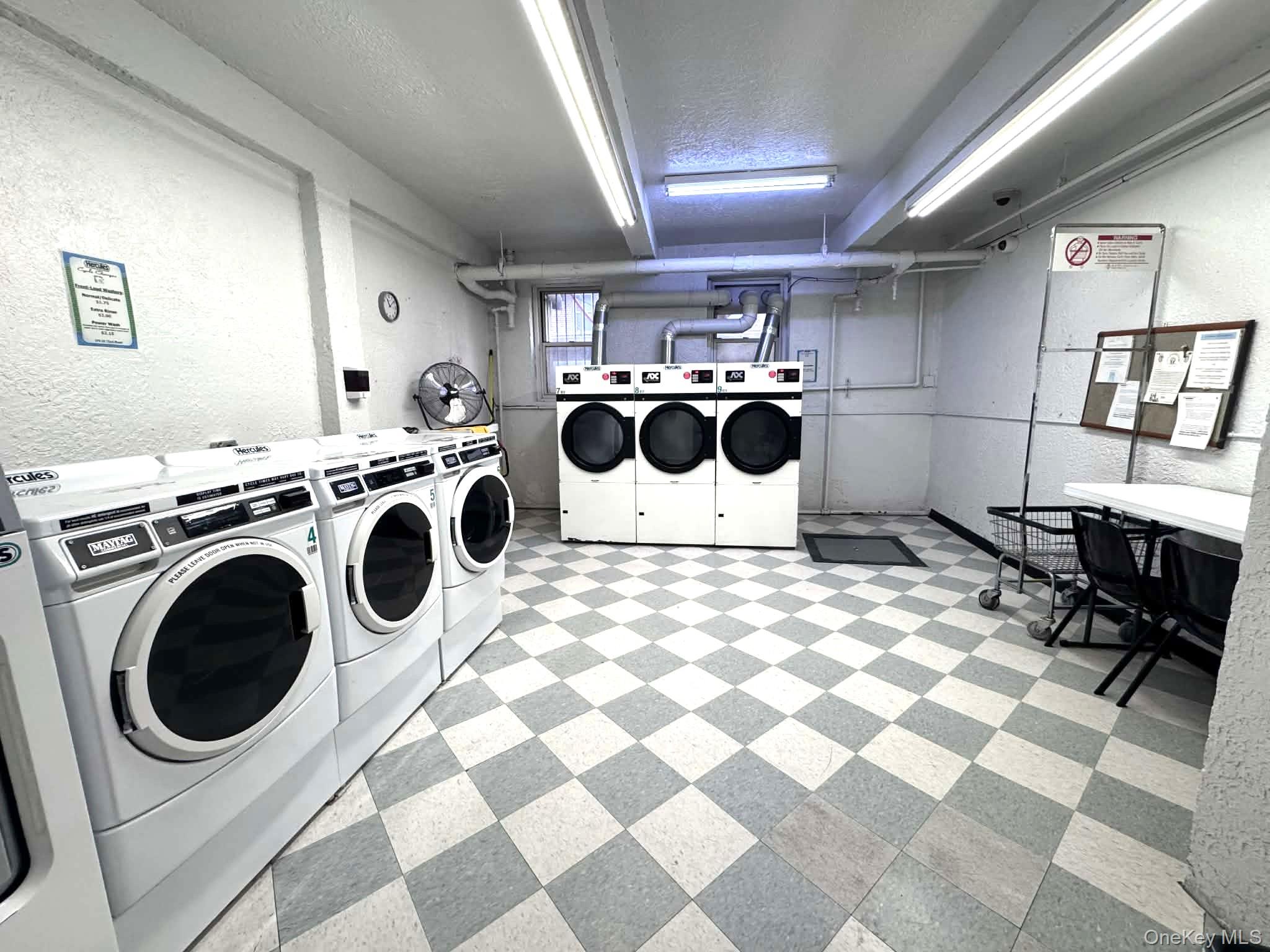 110-35 72nd Road, Unit 503 Queens, NY 11375 - Photo 15 of 15 a utility room with dryer and washer