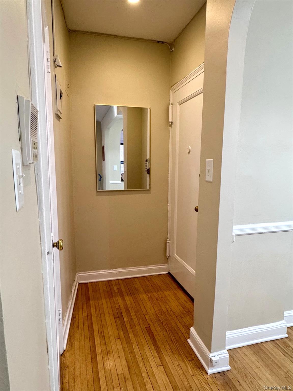 110-35 72nd Road, Unit 503 Queens, NY 11375 - Photo 2 of 15 a view of room with wooden floor and bathroom