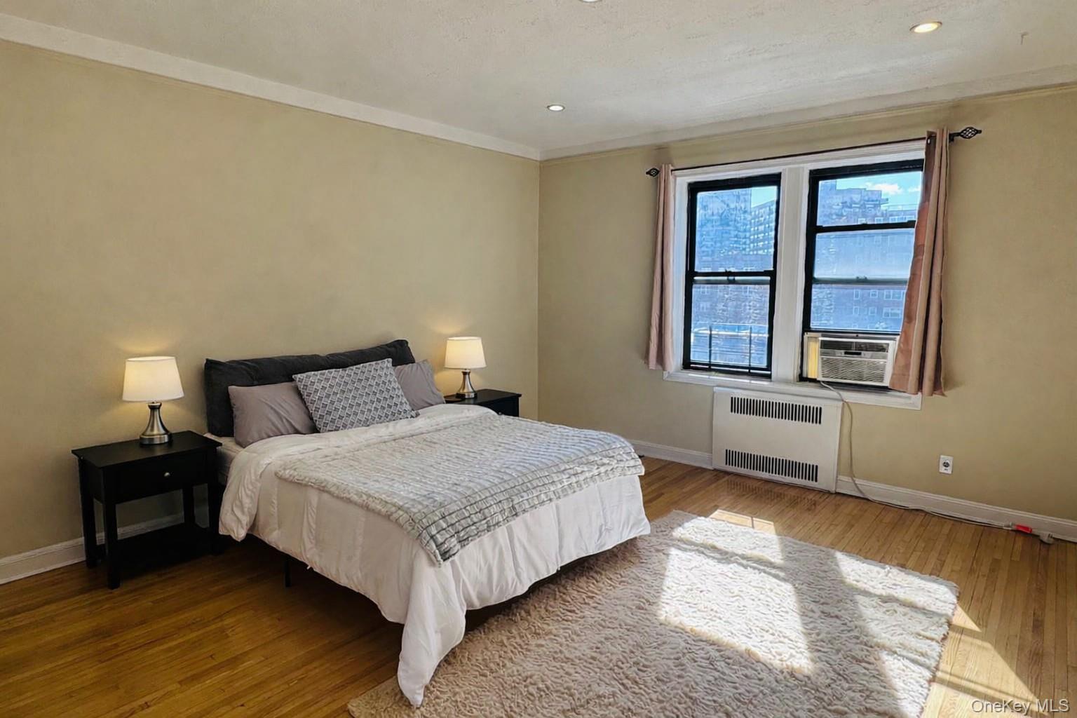 110-35 72nd Road, Unit 503 Queens, NY 11375 - Photo 10 of 15 a bedroom with a bed and window