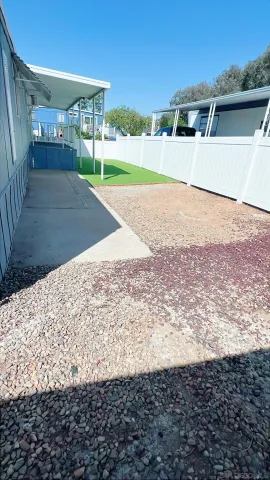 a view of a backyard of the house