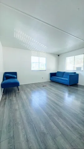 a view of room with wooden floor