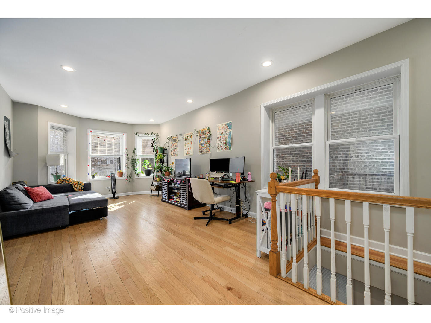 1330 West Roscoe Street Chicago, IL 60657 - Photo 13 of 26 a living room with furniture and a large window