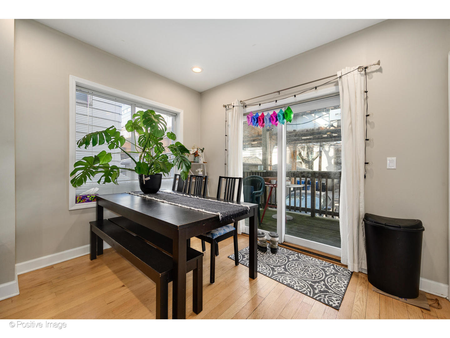 1330 West Roscoe Street Chicago, IL 60657 - Photo 17 of 26 a view of a dining room with furniture and a potted plant