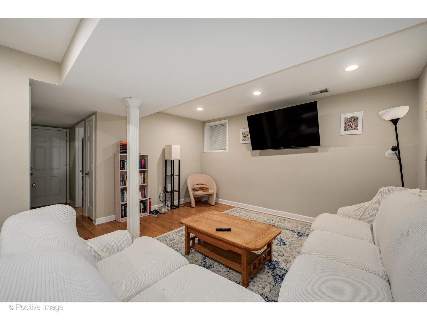 1330 West Roscoe Street Chicago, IL 60657 - Photo 21 of 26 a living room with furniture and a flat screen tv
