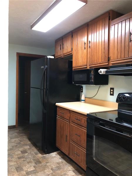 354 Strawcutter Road Derry, PA 15627 - Photo 6 of 22 Kitchen also has area for bar stools on other side of the Sink area
