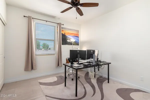 a workspace with furniture and a window